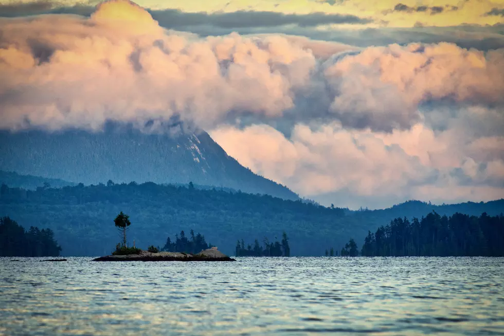 A large Mountain in the distance overlooking Moosehead Lake