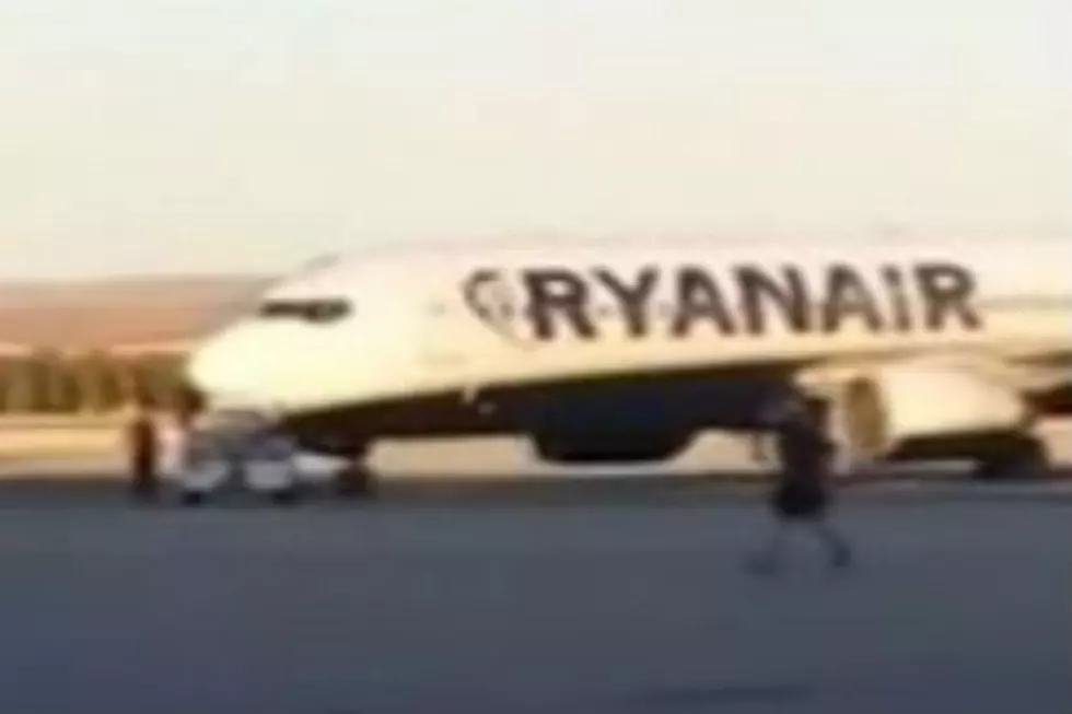 Watch: This Guy Literally Chases His Flight Down the Runway