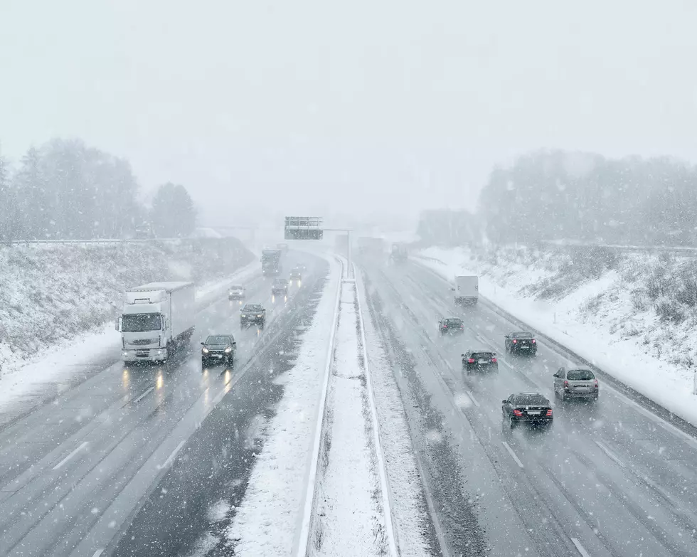 Winter driving - commuter traffic on a highway - expressway - snowfall