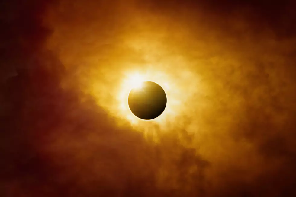 Dramatic scientific background - full sun eclipse in dark red sky