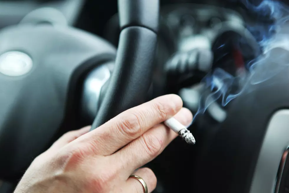 Men smoking in car