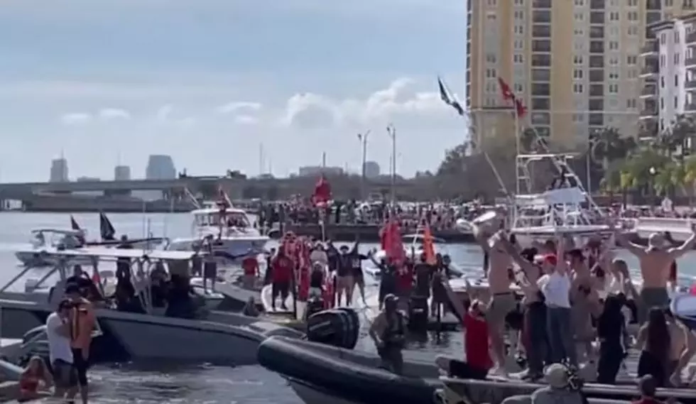 TB12 Throws Lombardi Trophy To Gronk Across the Water