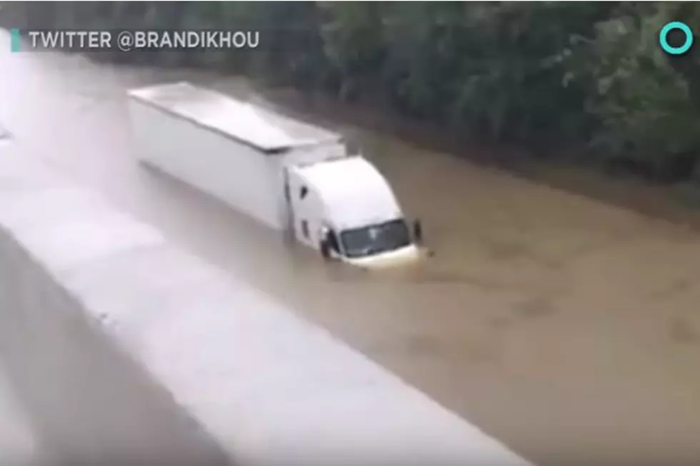 Reporter in Houston Saves a Truck Driver Who Was Submerged in Water
