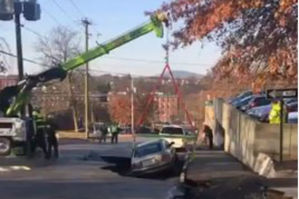 Car Fell into a Sinkhole on Langdon Street in Manchester