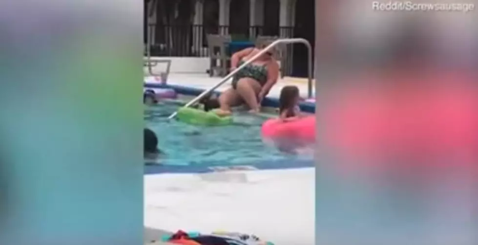 Is This Woman Shaving Her Legs In a Public Pool?