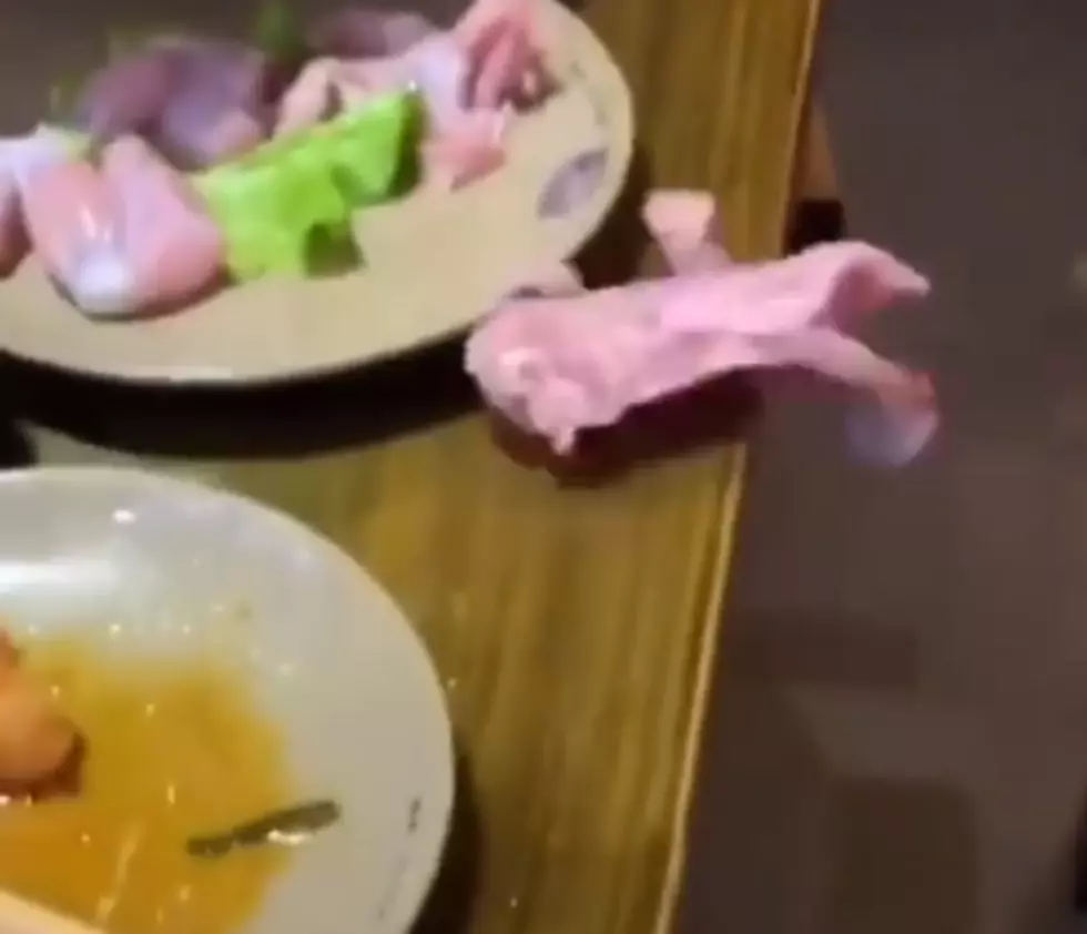 WATCH: A Woman&#8217;s Raw Chicken Jumps From Her Plate and Onto Floor