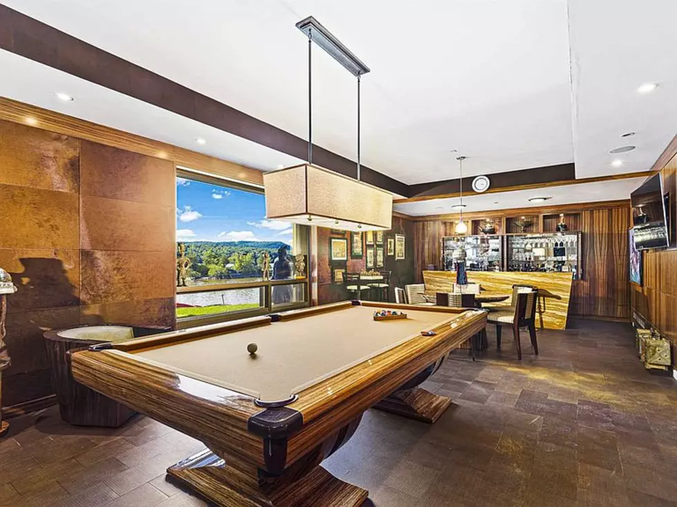A game room is just one of the home’s bonuses. Ledgerock also includes a gym, a spa, and a car wash.