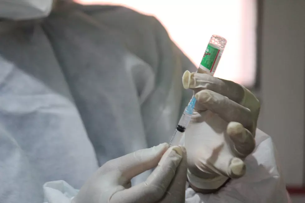 A Doctor prepares to administer the Pfizer-BioNTech COVID-19 vaccine at District Hospital Pulwama, South of Srinagar
