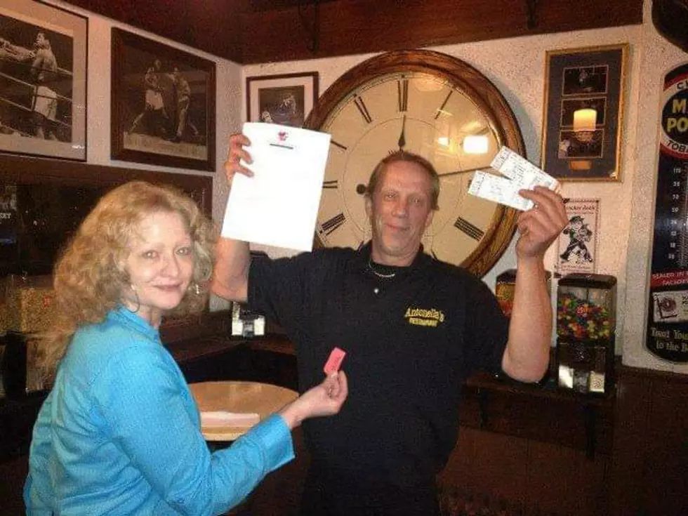 PDH Winner Dave Ludwig of Wappingers Fall holds up winning concert tickets at Noah's Ark in Poughkeepsie. Photo credit: The Rutigliano Archives