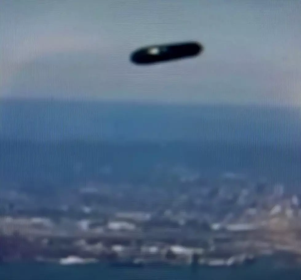 UFO Filmed Flying By Passenger Plane Leaving Airport in New York?