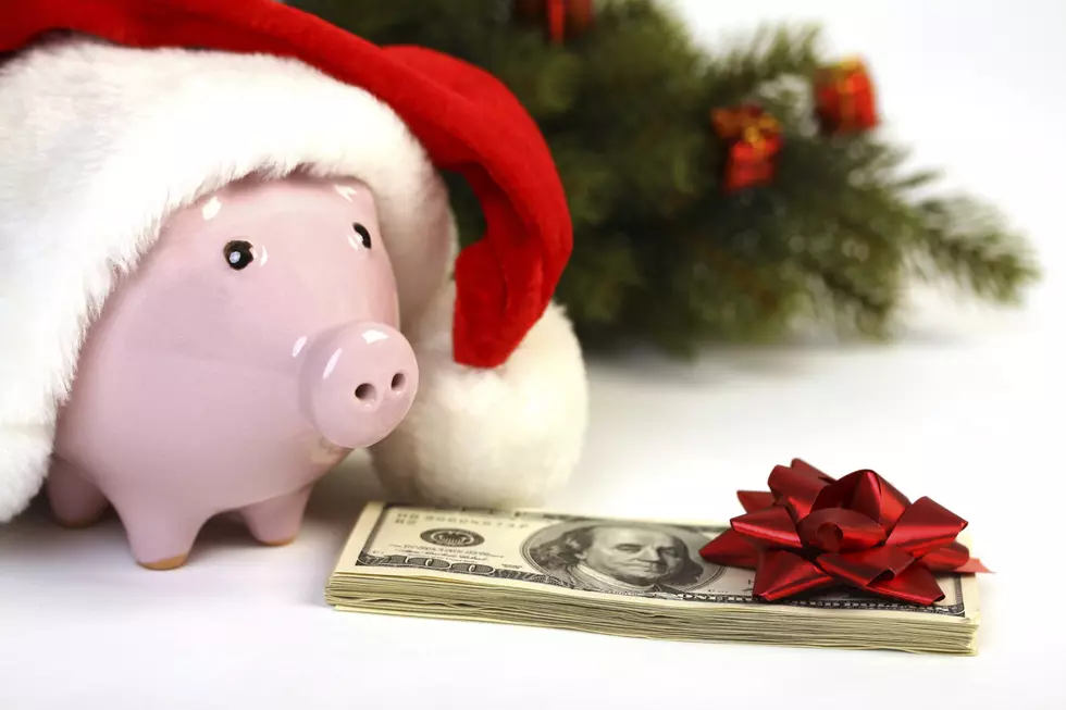 Piggy bank with Santa hat and money, christmas tree
