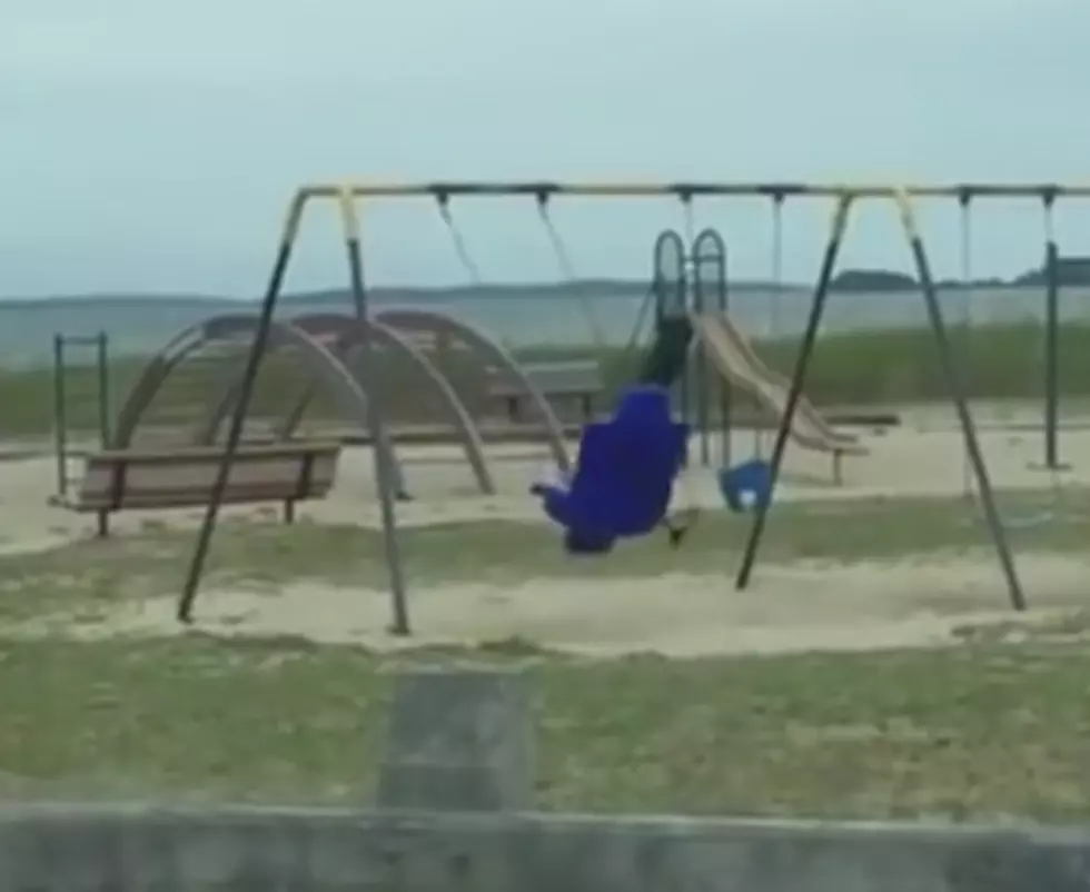 Dad Films Ghostly Swing at Kids Park! [VIDEO]