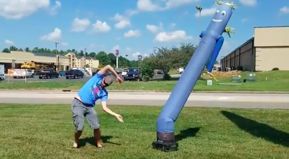 Who Dances Better, Dave or a Wind Machine Blow Up Guy? [WATCH]