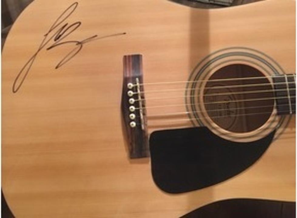 Luke Bryan Autographed Guitar Up For Auction!