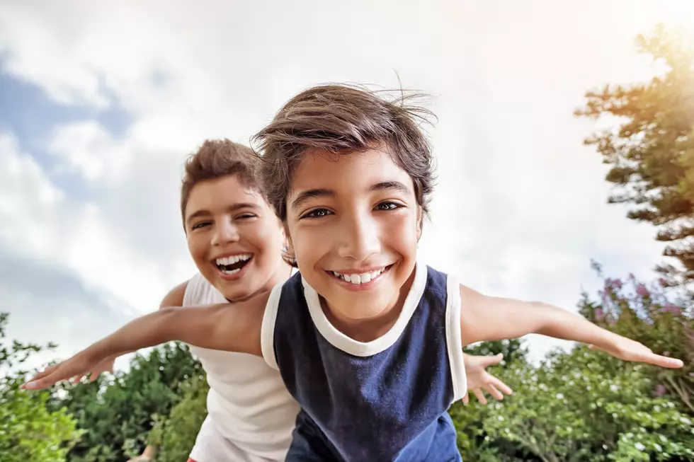 Happy brothers playing outdoors