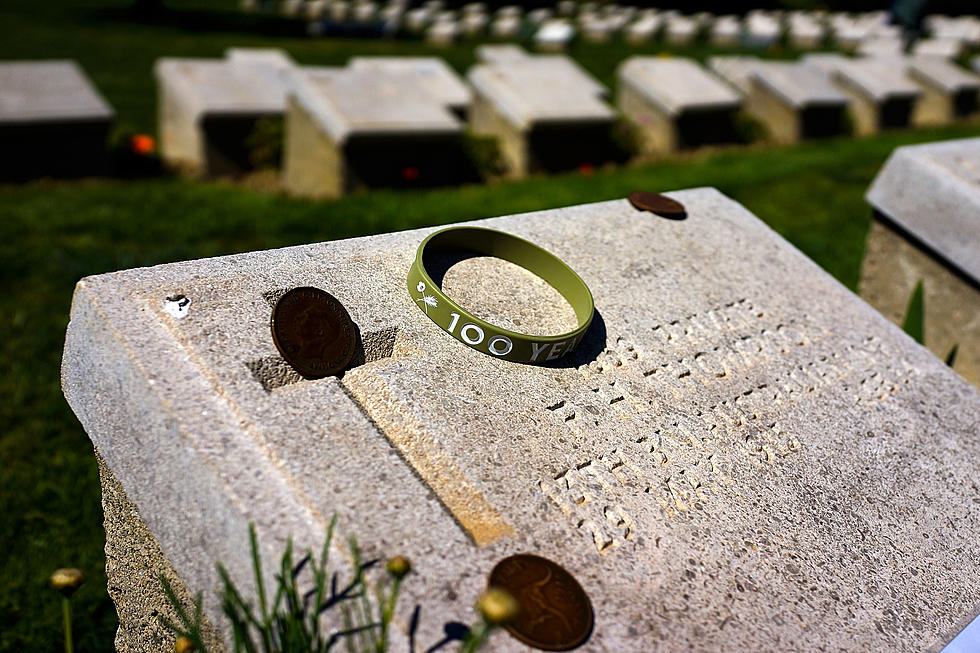 What Is the Meaning of Coins Left on a Grave?