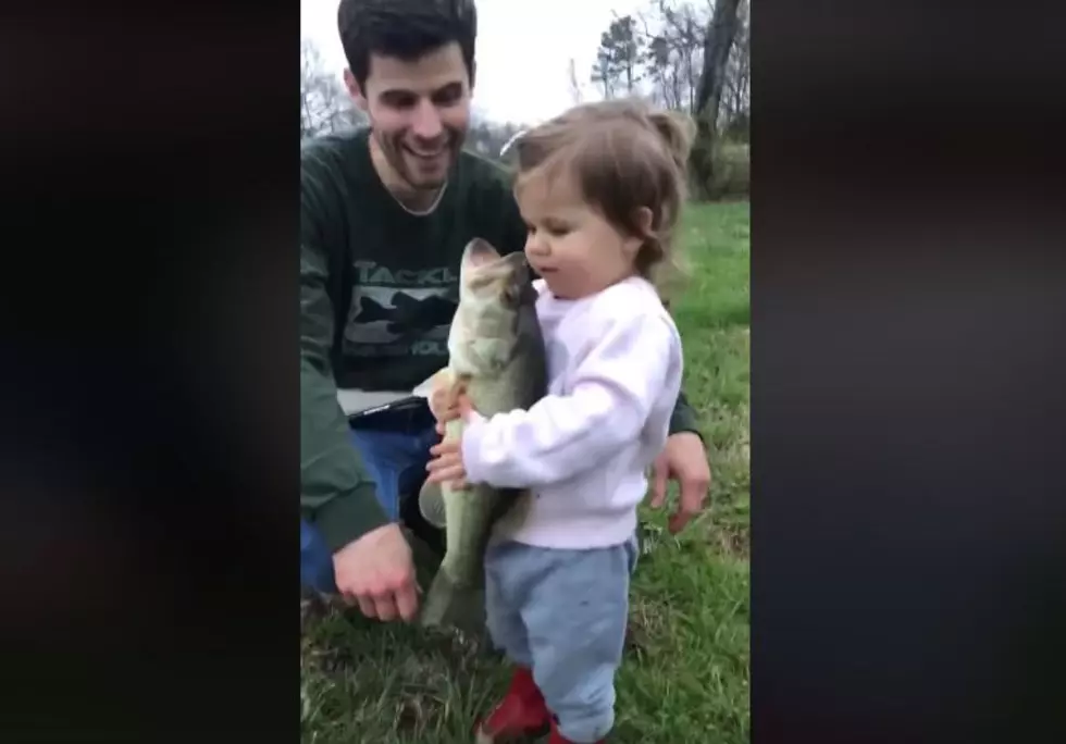 Adorable Girl Comforts Fish That Her Dad Just Caught [VIDEO]