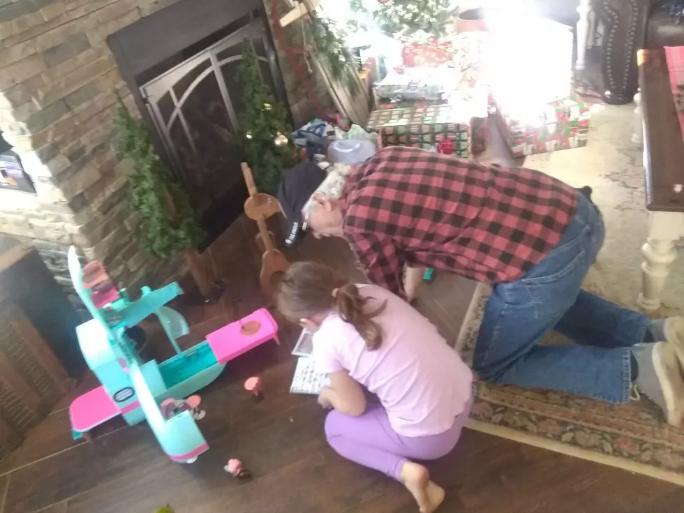 Pops and Ava putting toys together on Christmas morning. -Ashley s