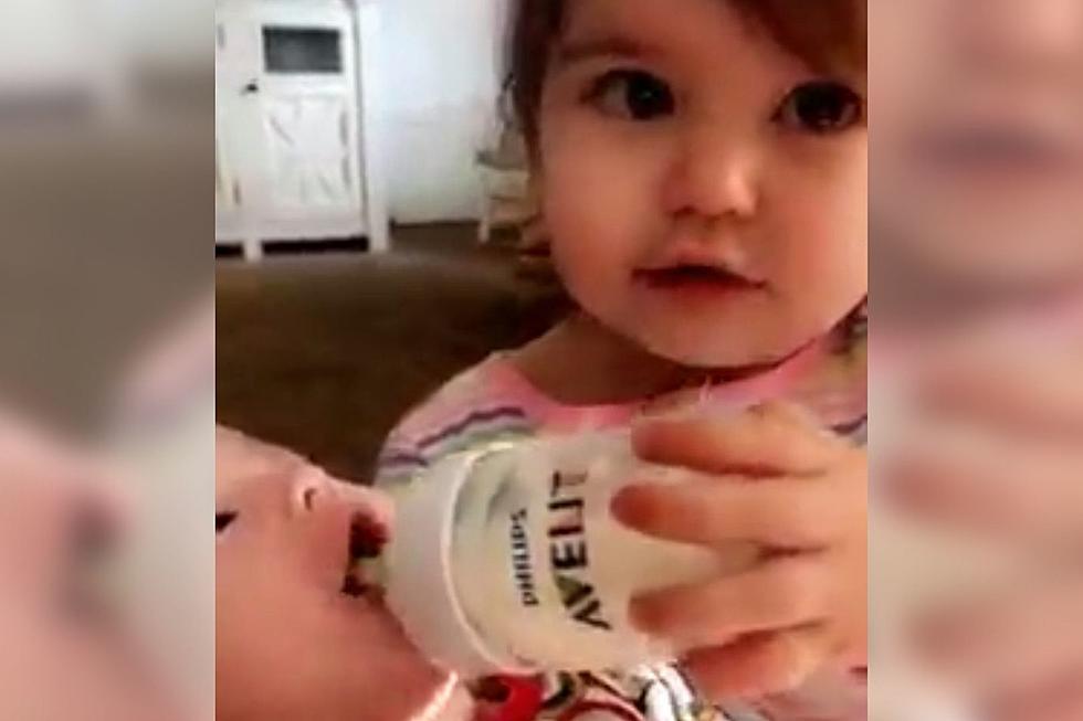 Indiana Toddler Trying Her Best To Feed Baby Brother With a Bottle Is Just Adorable