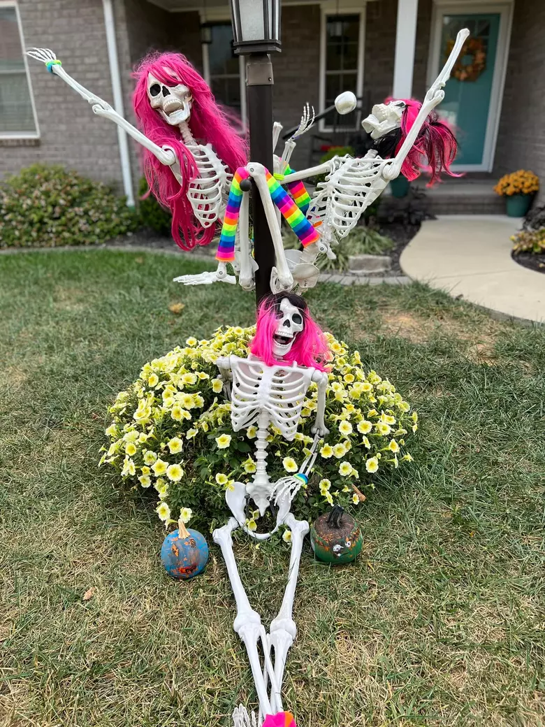 Our front lawn Halloween decor this year  We modded last year's skeleton  breakdancers into warrior II - inspired by starting yoga recently! : r/yoga