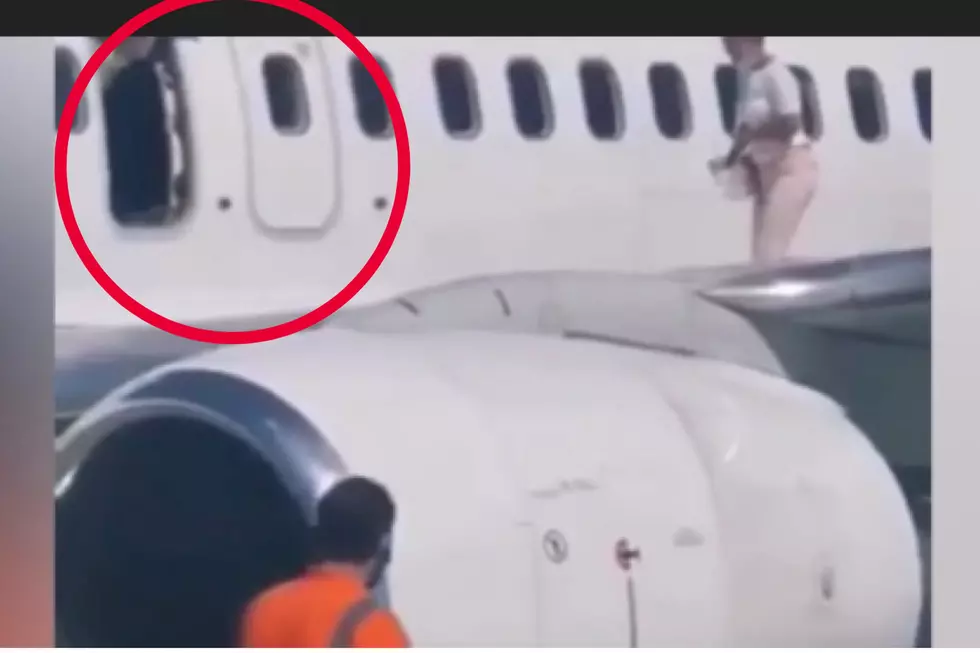Woman Opens Emergency Exit To Get Onto Plane Wing [Video]