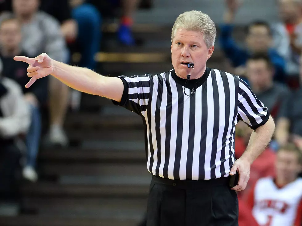 Referee on His Cell Phone During Basketball Game