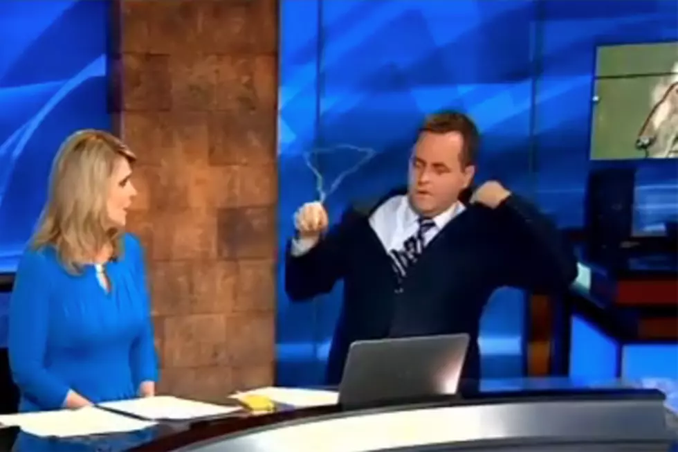 Weatherman Realizes There’s Still a Coat Hanger in His Suit