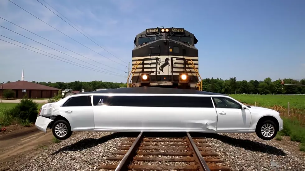 Limo Takes on a Freight Train and Loses