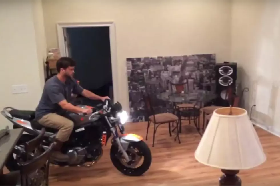 Guy Attempts a Wheelie in His Living Room