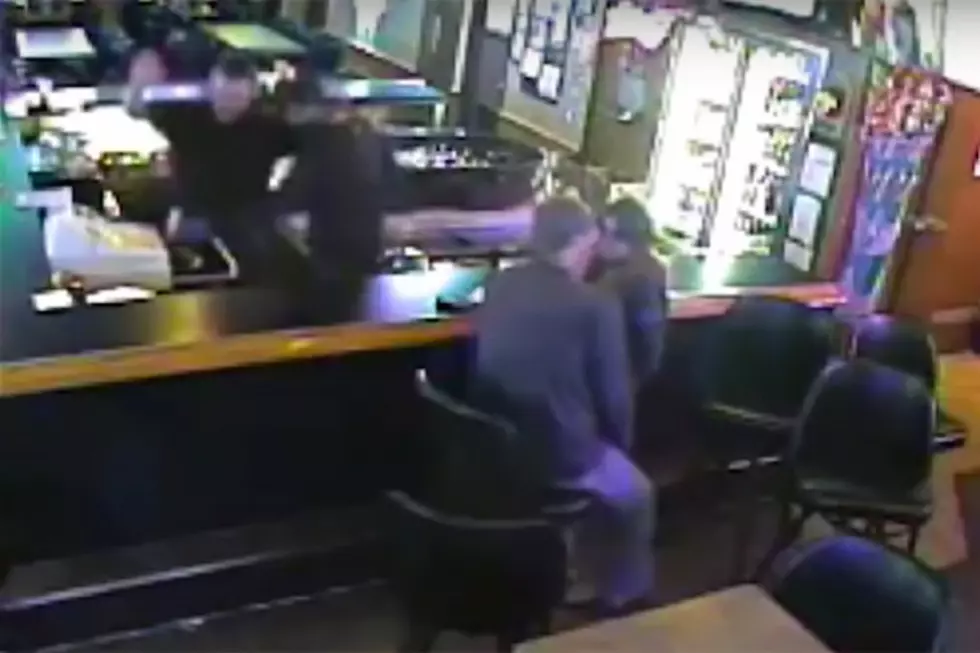 Couple at a Bar Are So Busy Making Out They Don’t Notice the Place Being Robbed