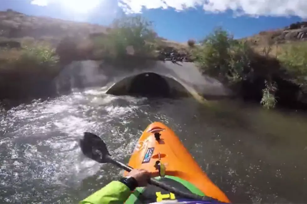 Fearless Kayaker Slides Down Drainage Pipe
