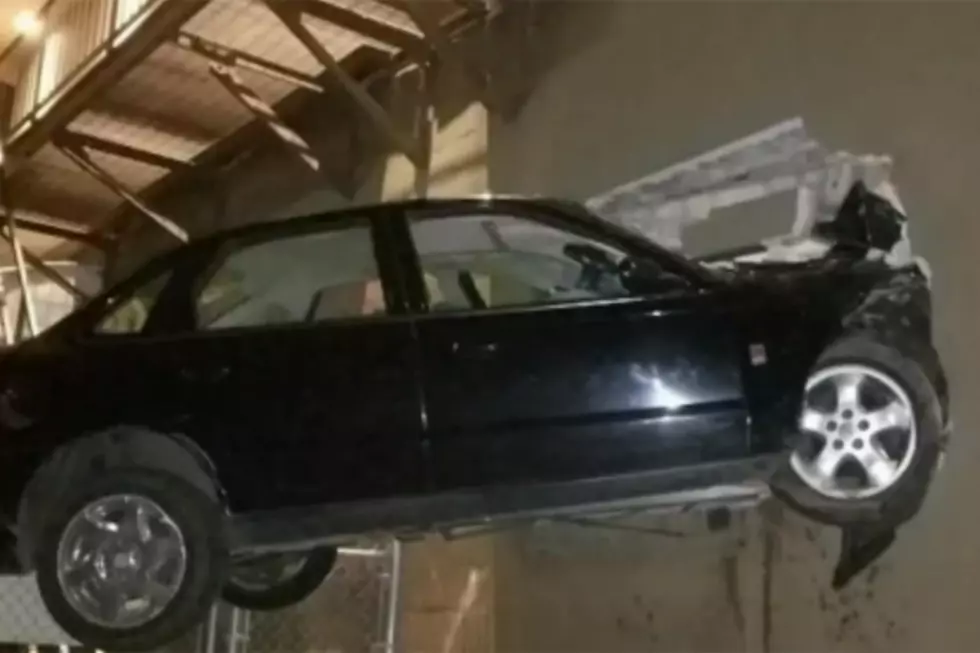 Man Crashes Car into the Side of a Building Eight Feet Off the Ground
