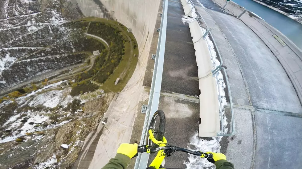 Daredevil Bikes Along Handrail Atop 650-Foot Tall Dam