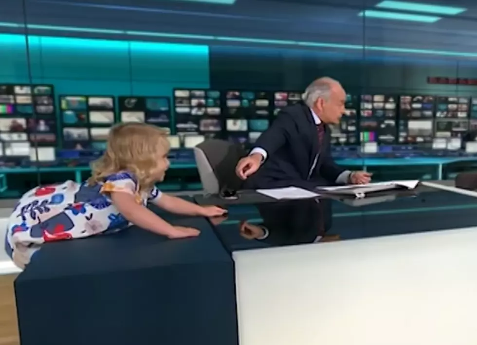 Little Girl Interrupts Interview By Climbing on Anchor&#8217;s Desk