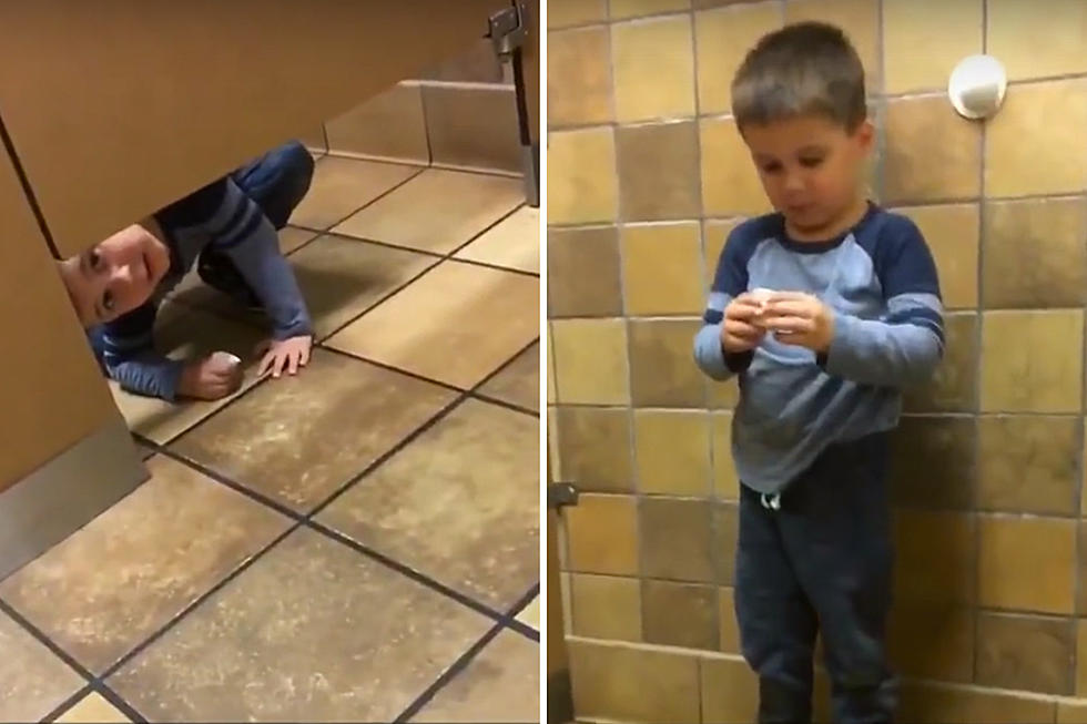 Curious Kid Crawls Under Bathroom Stall Door