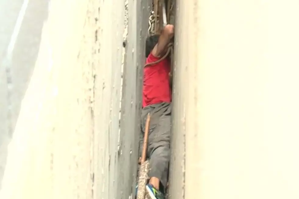 Man Gets Caught Between Two Walls Retrieving a Baseball