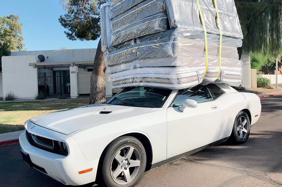 Sports Car Spotted Carrying Half-Dozen Mattresses on Roof