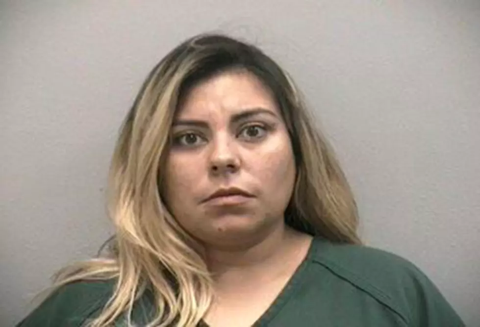 Woman Arrested After Driving Topless While Giving Boyfriend Sexual Favors
