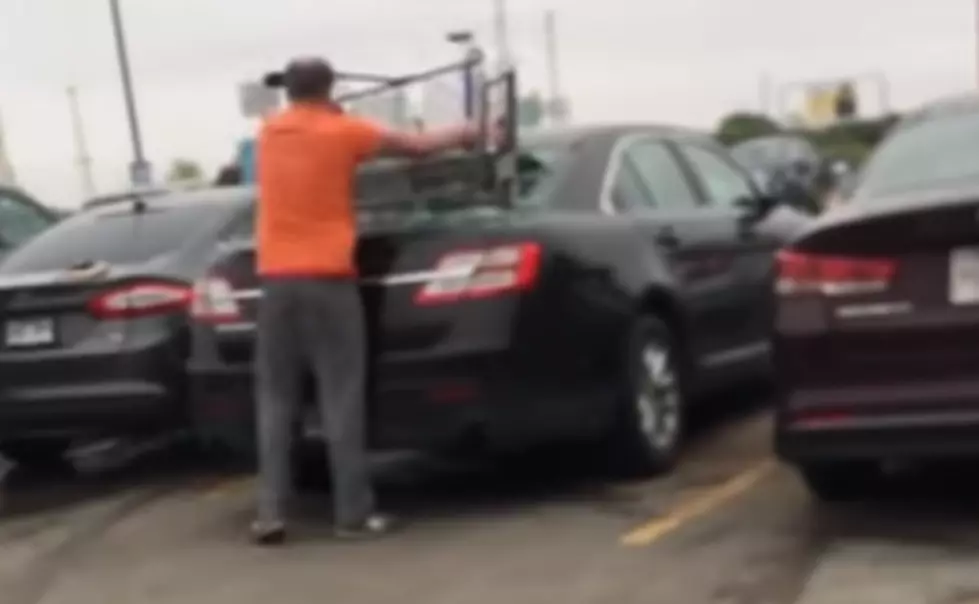 Watch Some Idiot Bash a Grocery Cart Through a Car Window