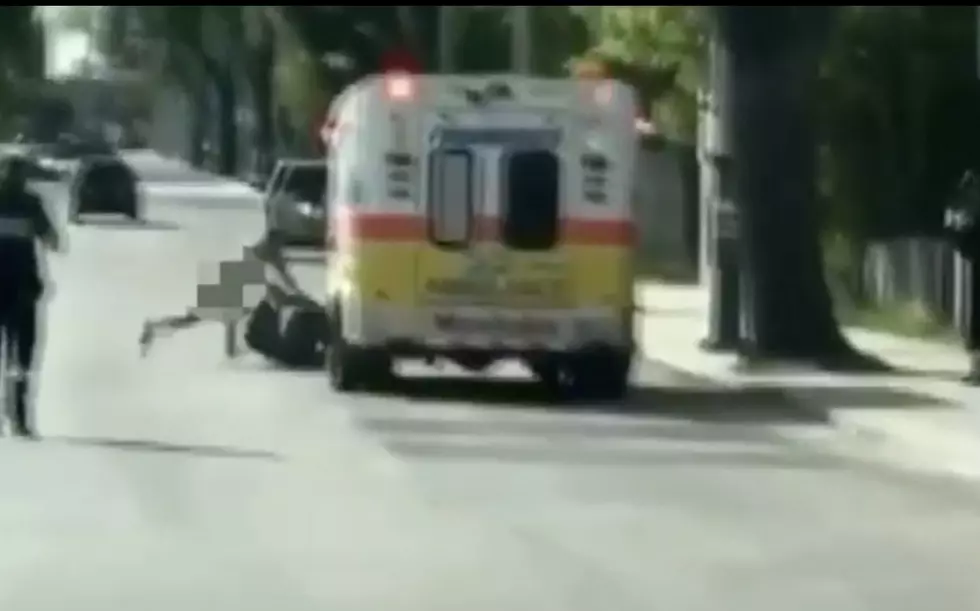 VIDEO: Naked Man Steals Ambulance, Crashes into Building