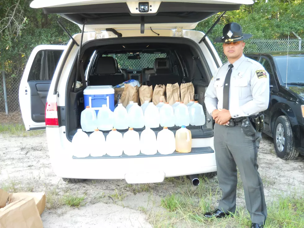 Driver Stopped For Speeding Busted For Running Load of Moonshine in Gallon Jugs