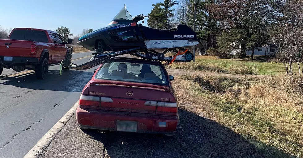 State Patrol Pulls Over Car with Snowmobile on Roof