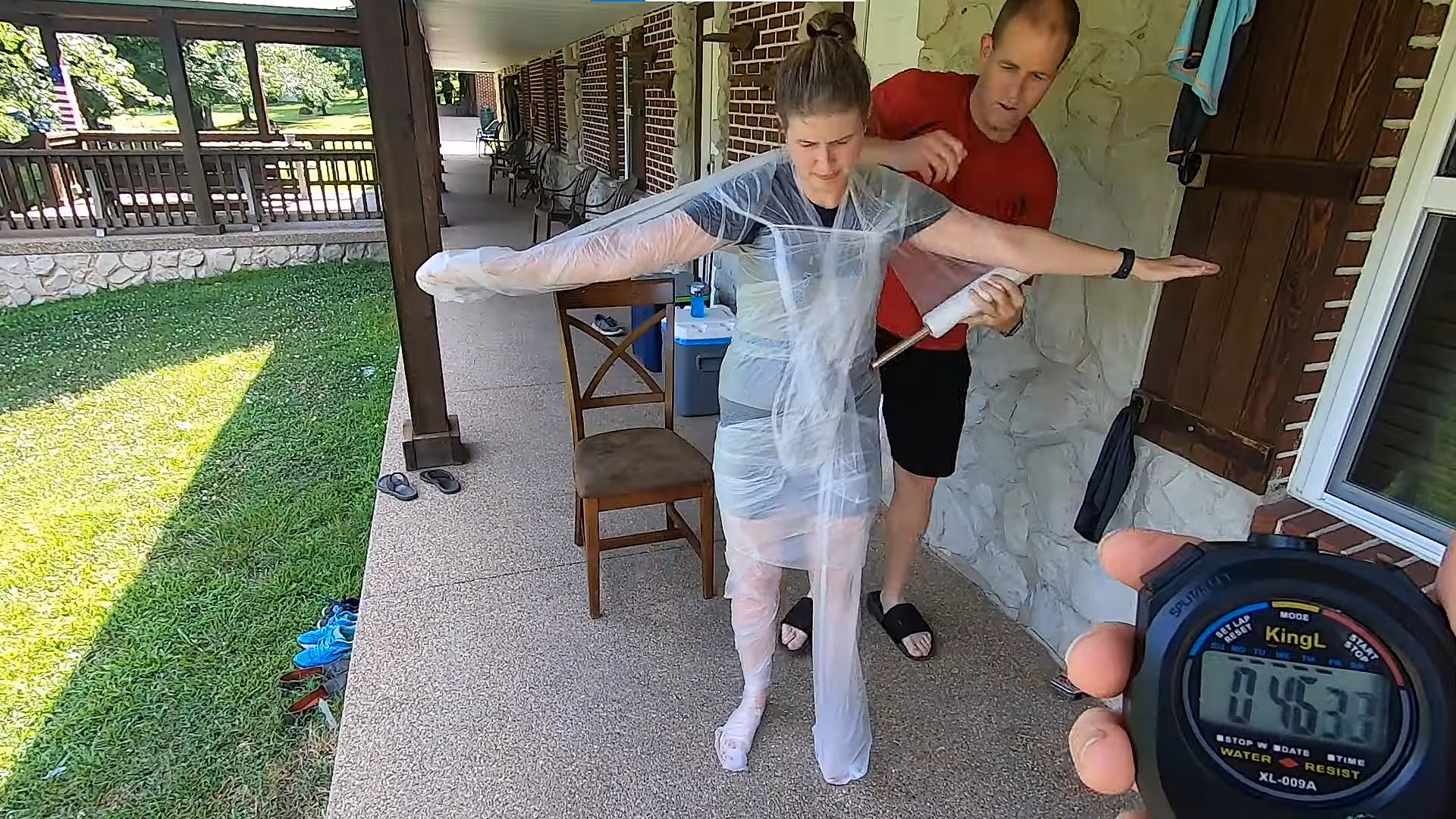 Man Recaptures Guinness World Record For Wrapping Wife in Plastic Wrap photo