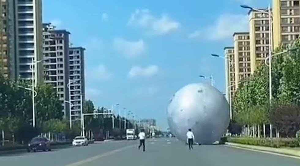 Moon Festival Staff Panic As They Chase Runaway Giant Moon Down Street
