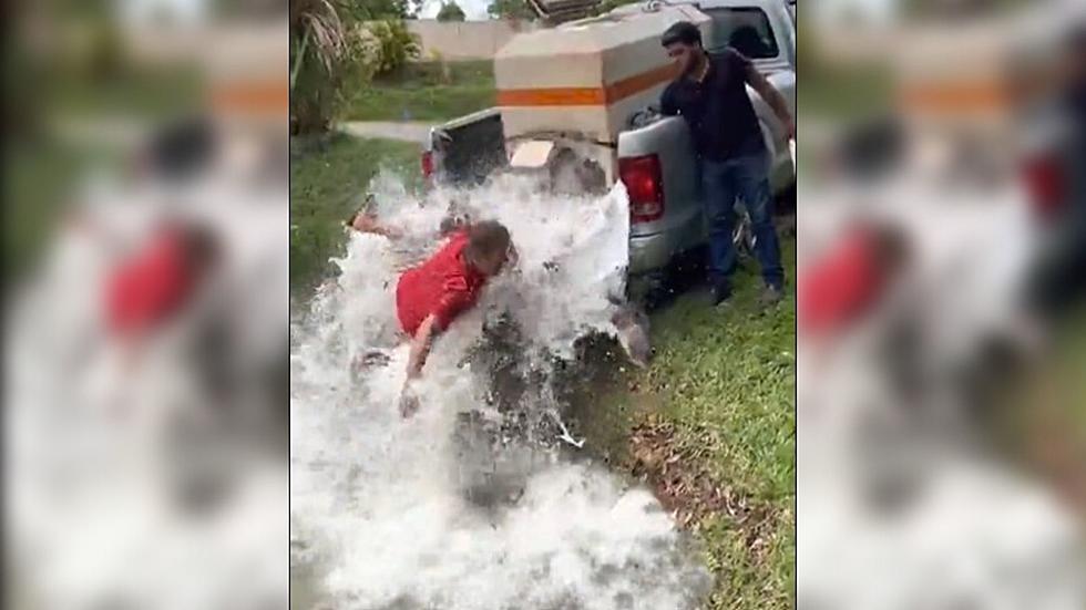 VIDEO: Man Slips and Falls While Stocking Pond With Fish