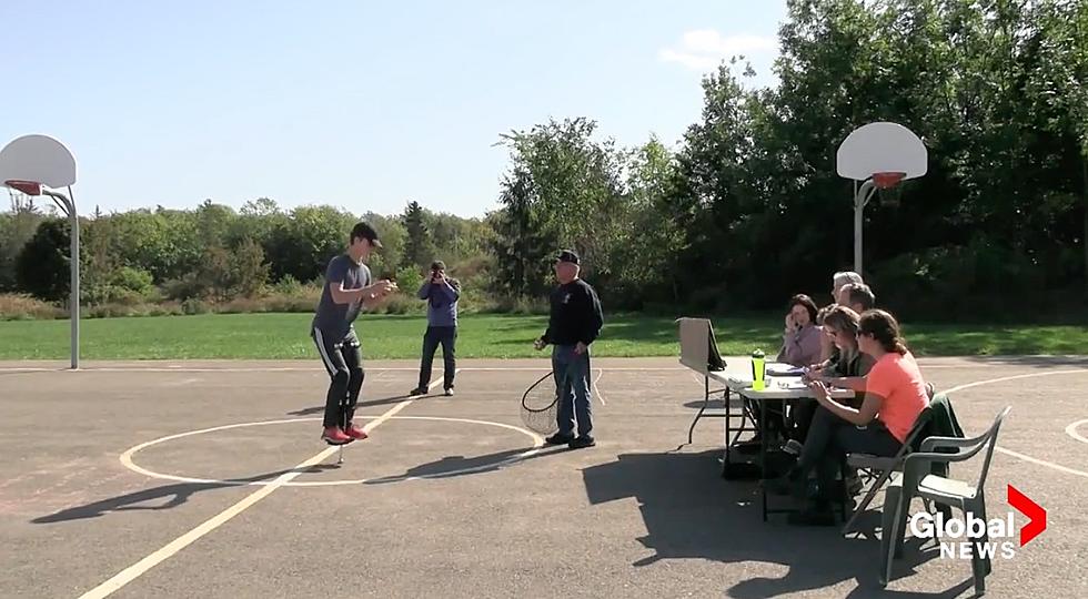 Teen Breaks World Record Solving 211 Rubik&#8217;s Cubes While Pogo Sticking