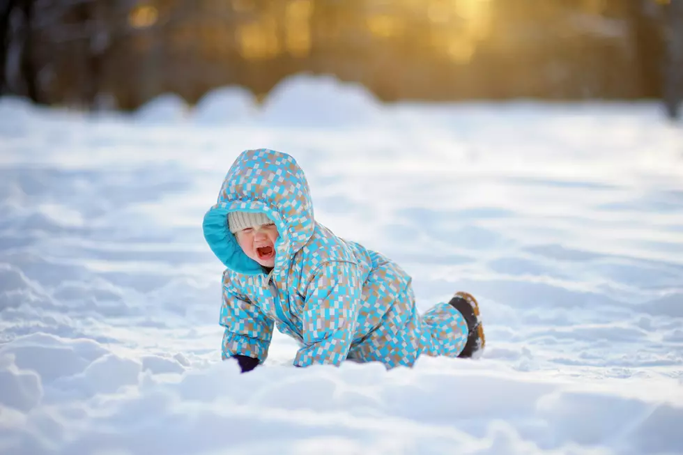 Outdoors portrait of crying toddler boy