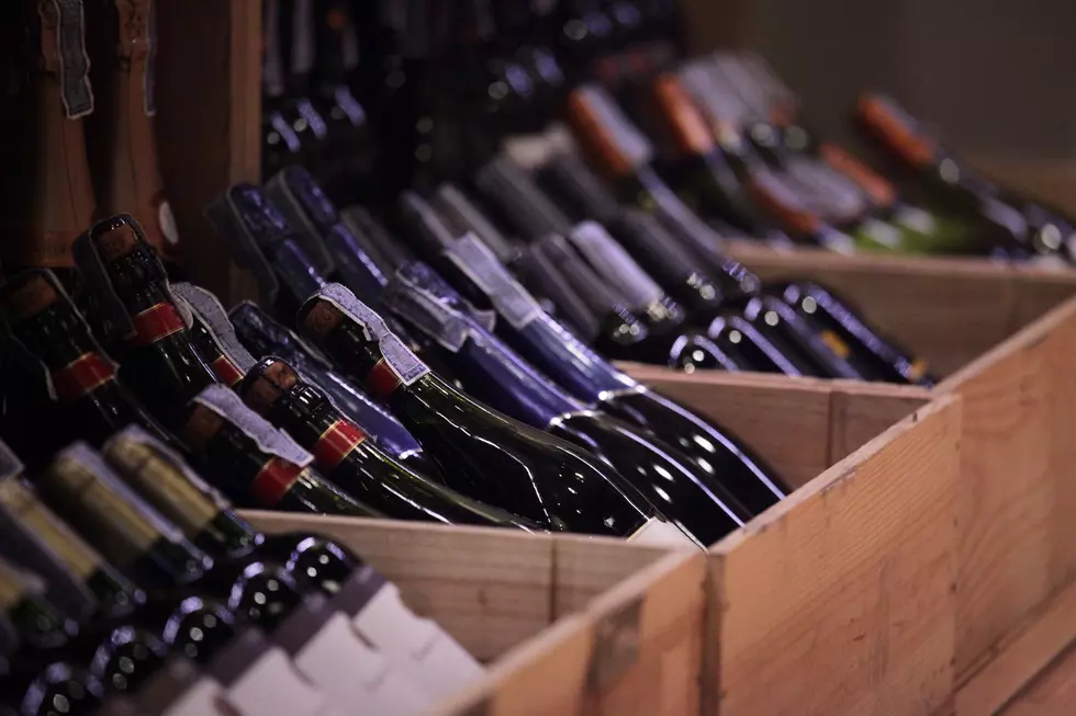 variety of wine in crates at retail shop