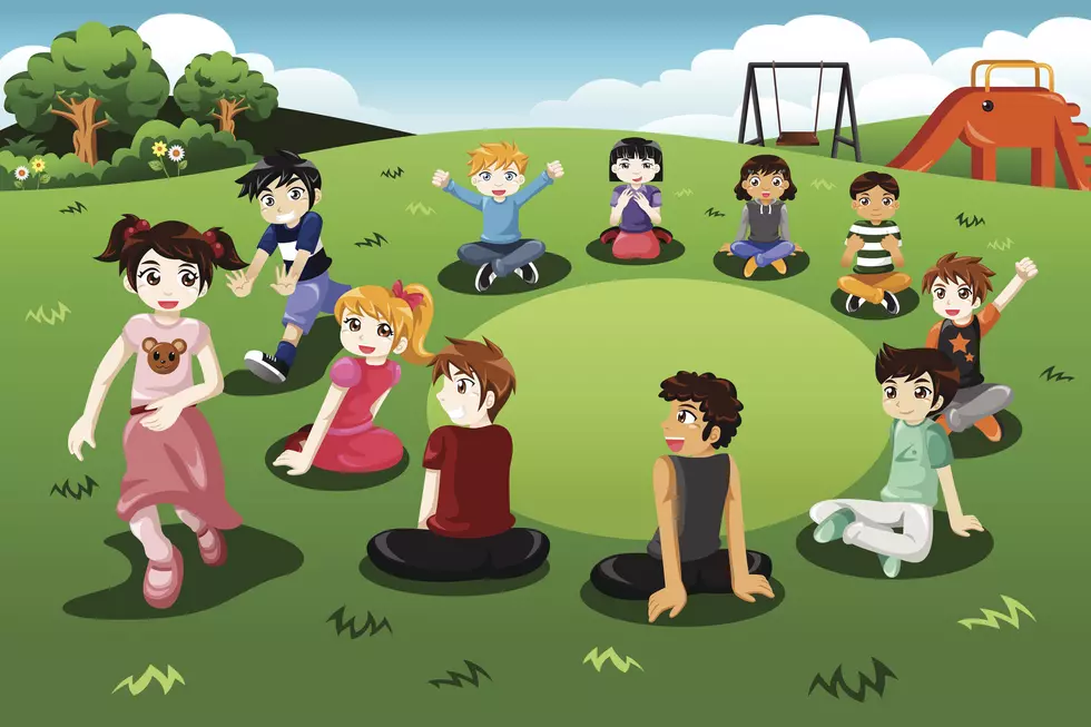 Kids playing duck duck goose