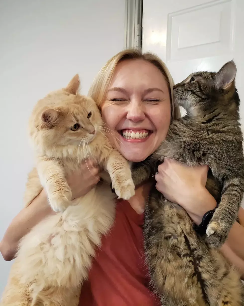carly holding her two cats